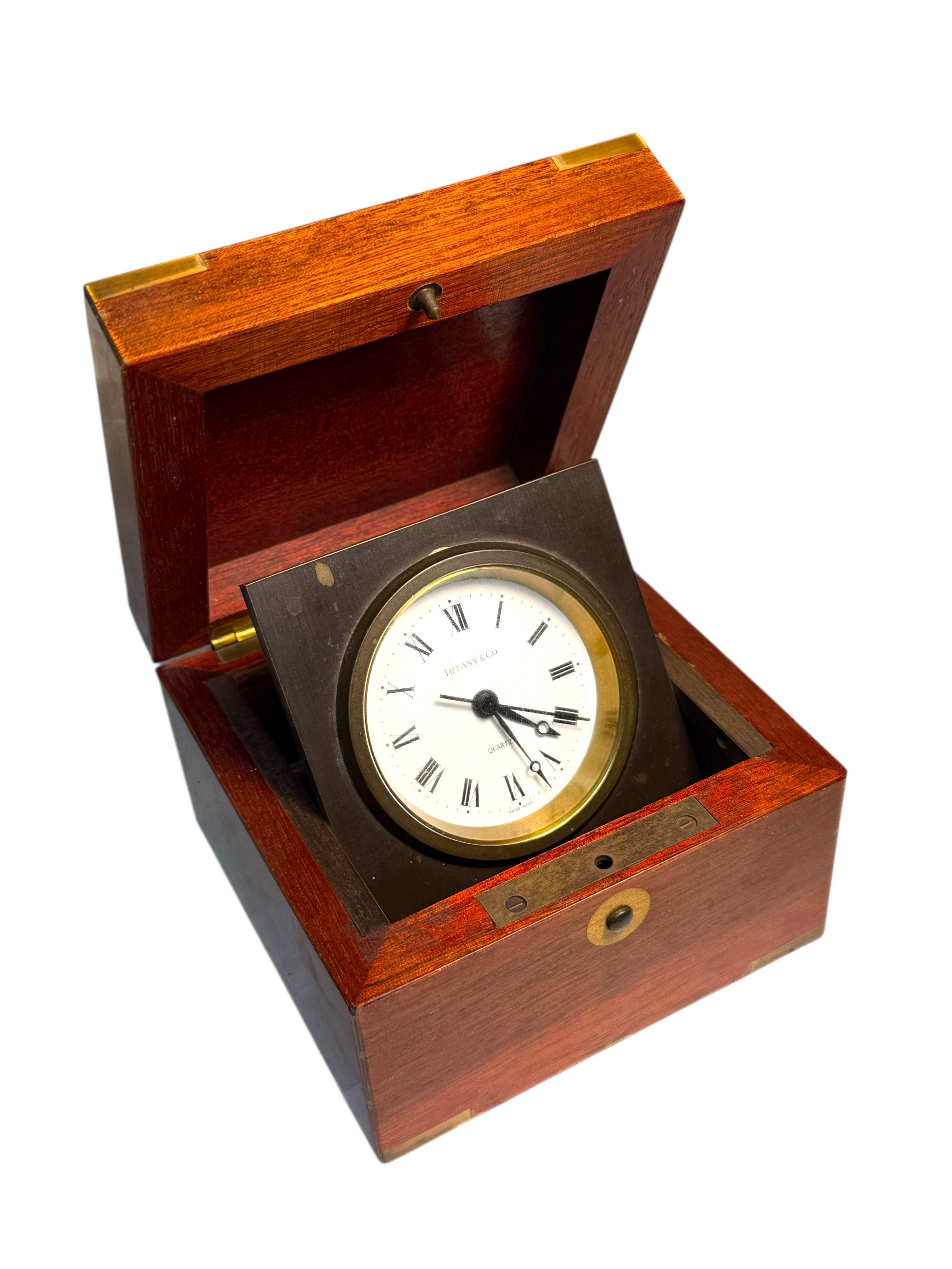 A Tiffany & Co. Swiss Brass Mounted Mahogany Cased Desk Timepiece