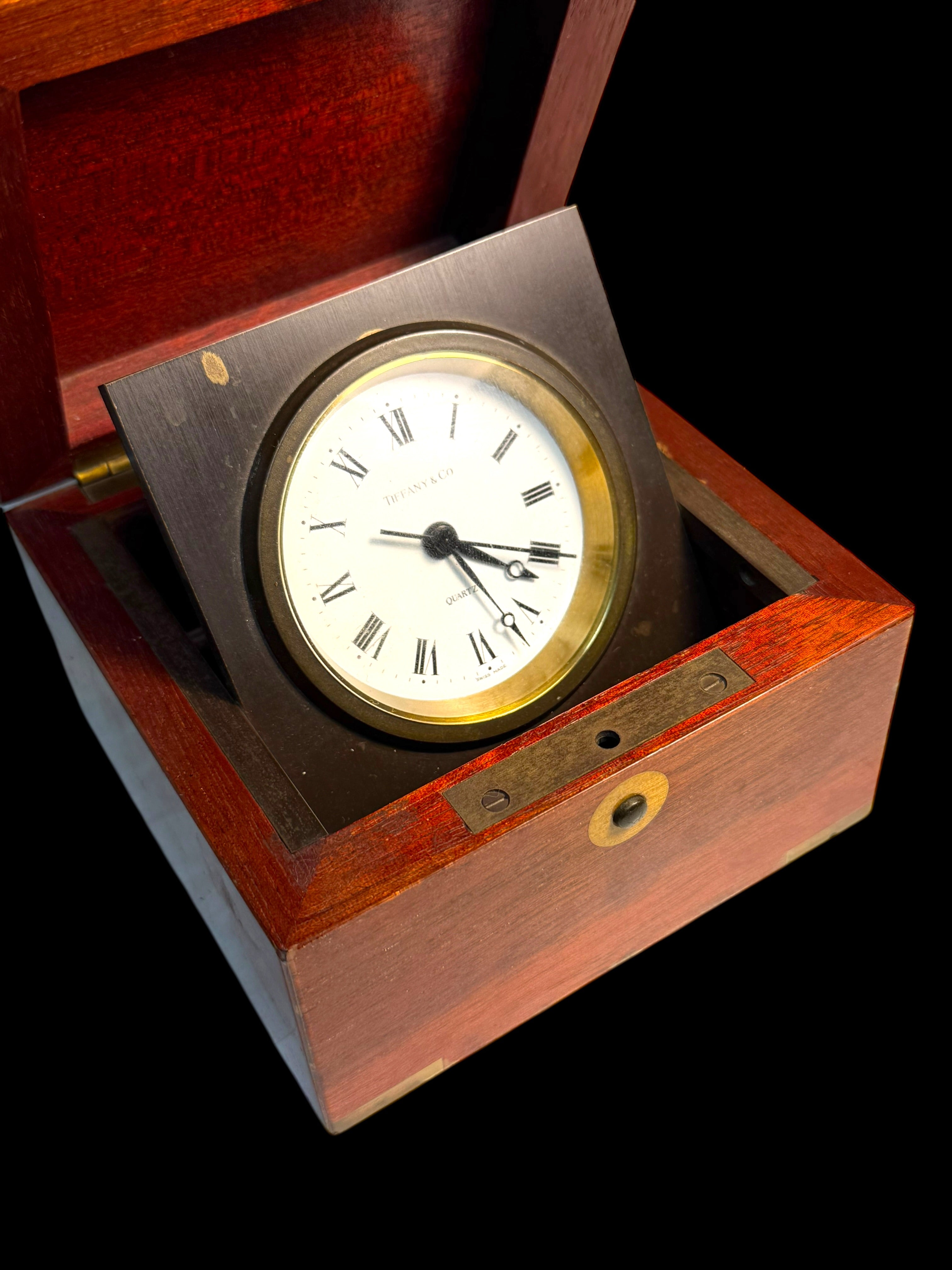 A Tiffany & Co. Swiss Brass Mounted Mahogany Cased Desk Timepiece