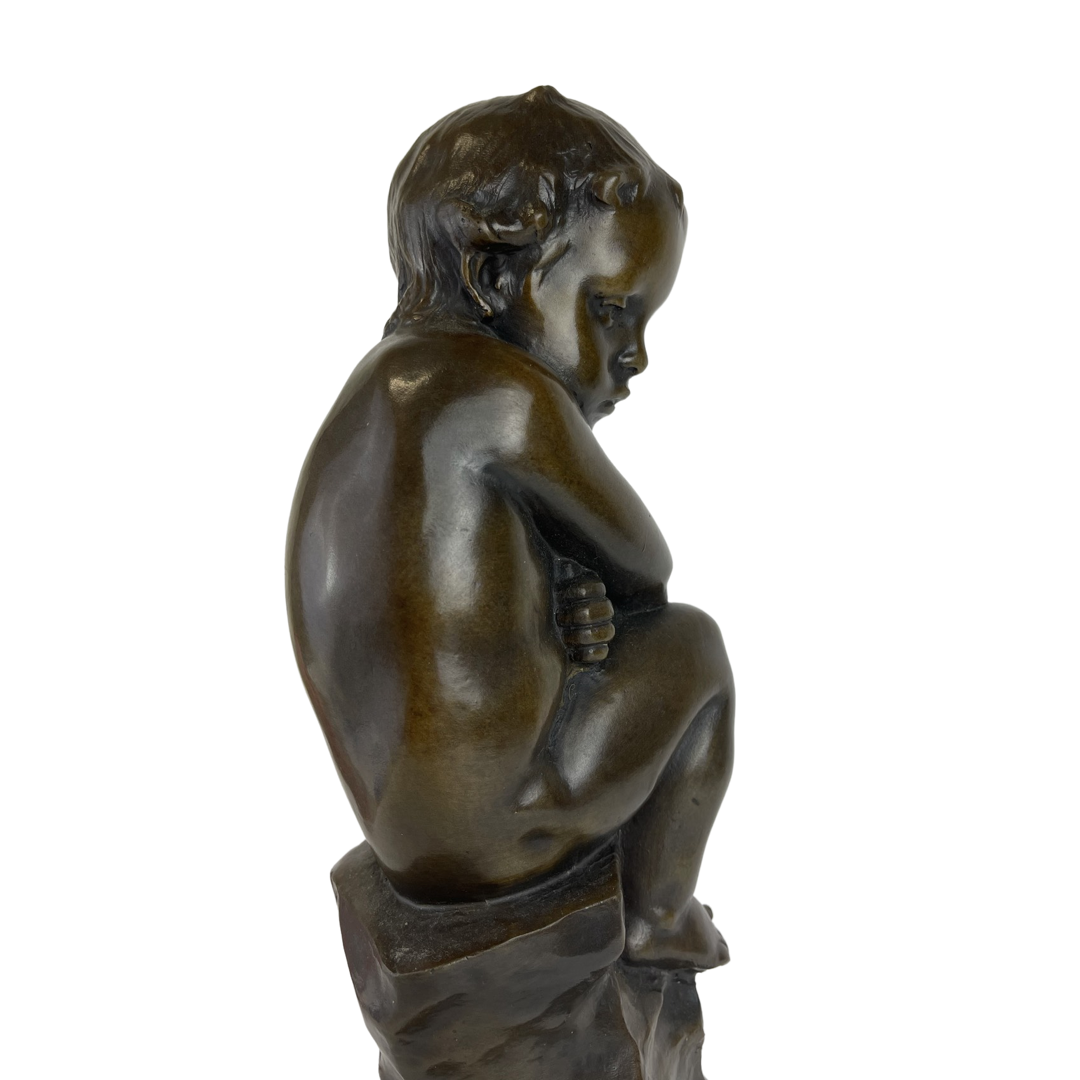 A Patinated Bronze Figure Of A Seated Cupid Circa 1900