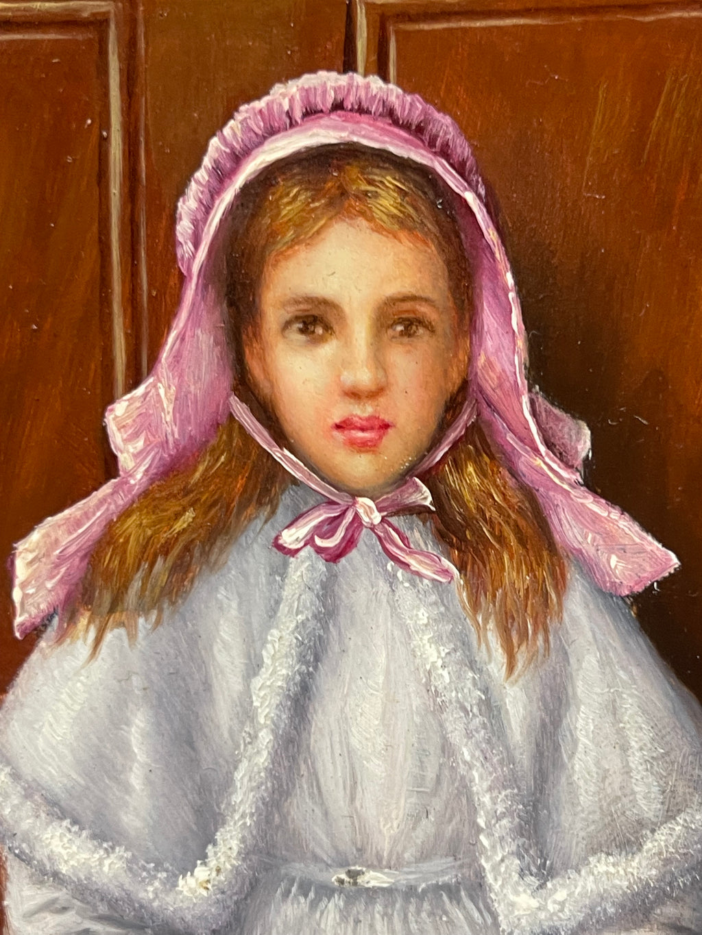 An Oil on Board Painting Depicting a Seated Young Girl at a Train Station