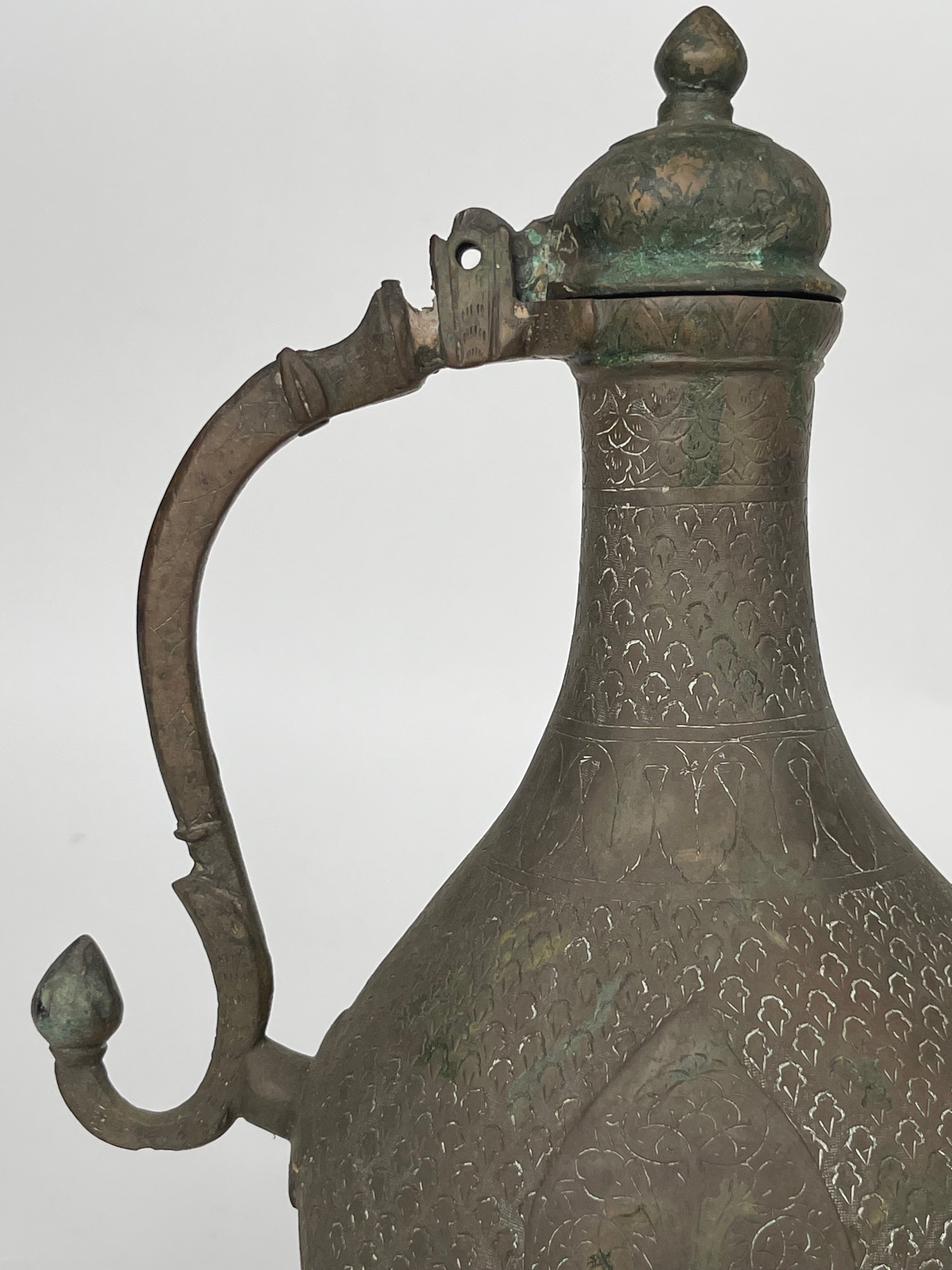 A Persian Hand Engraved Brass Pitcher