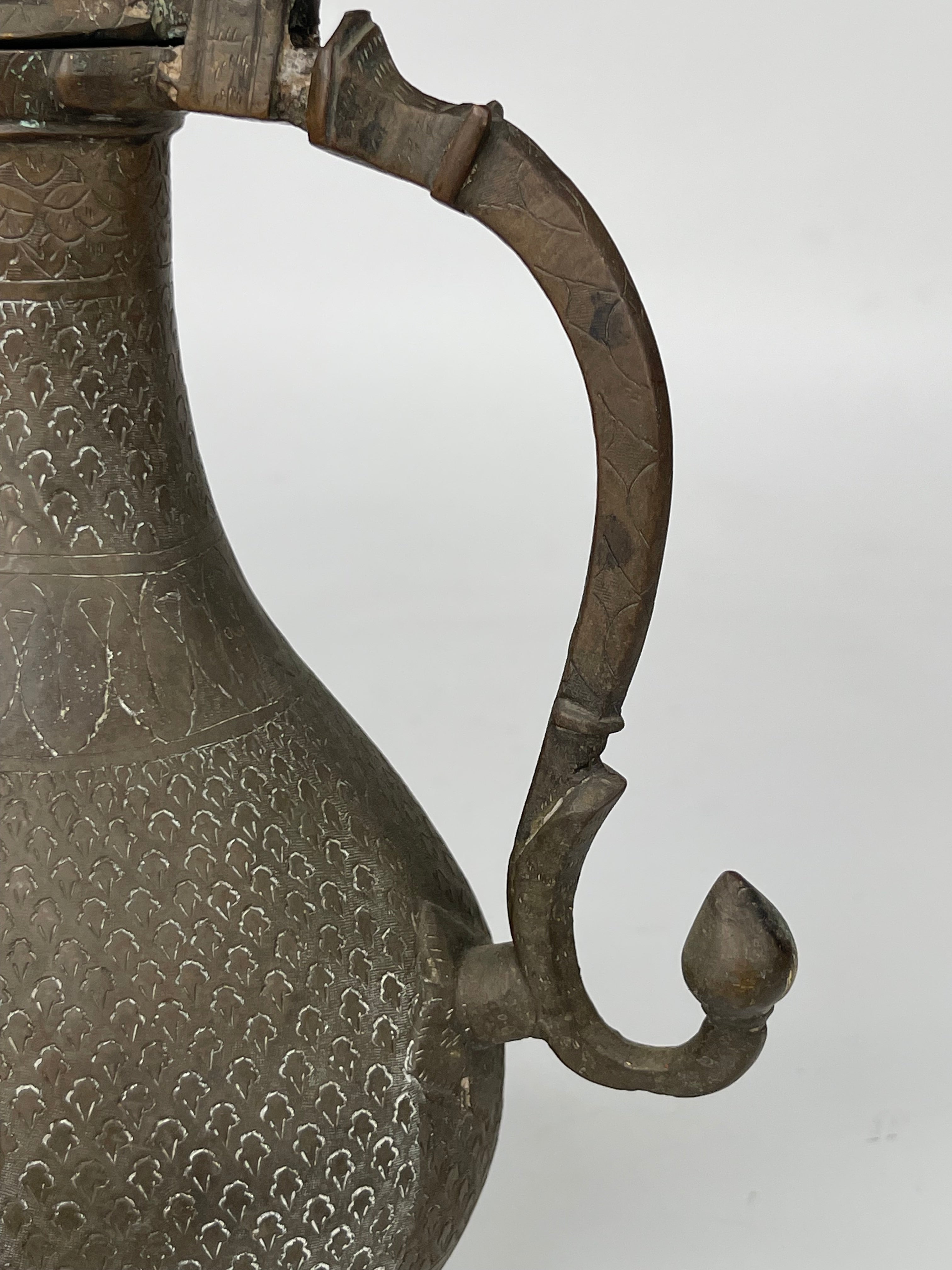 A Persian Hand Engraved Brass Pitcher