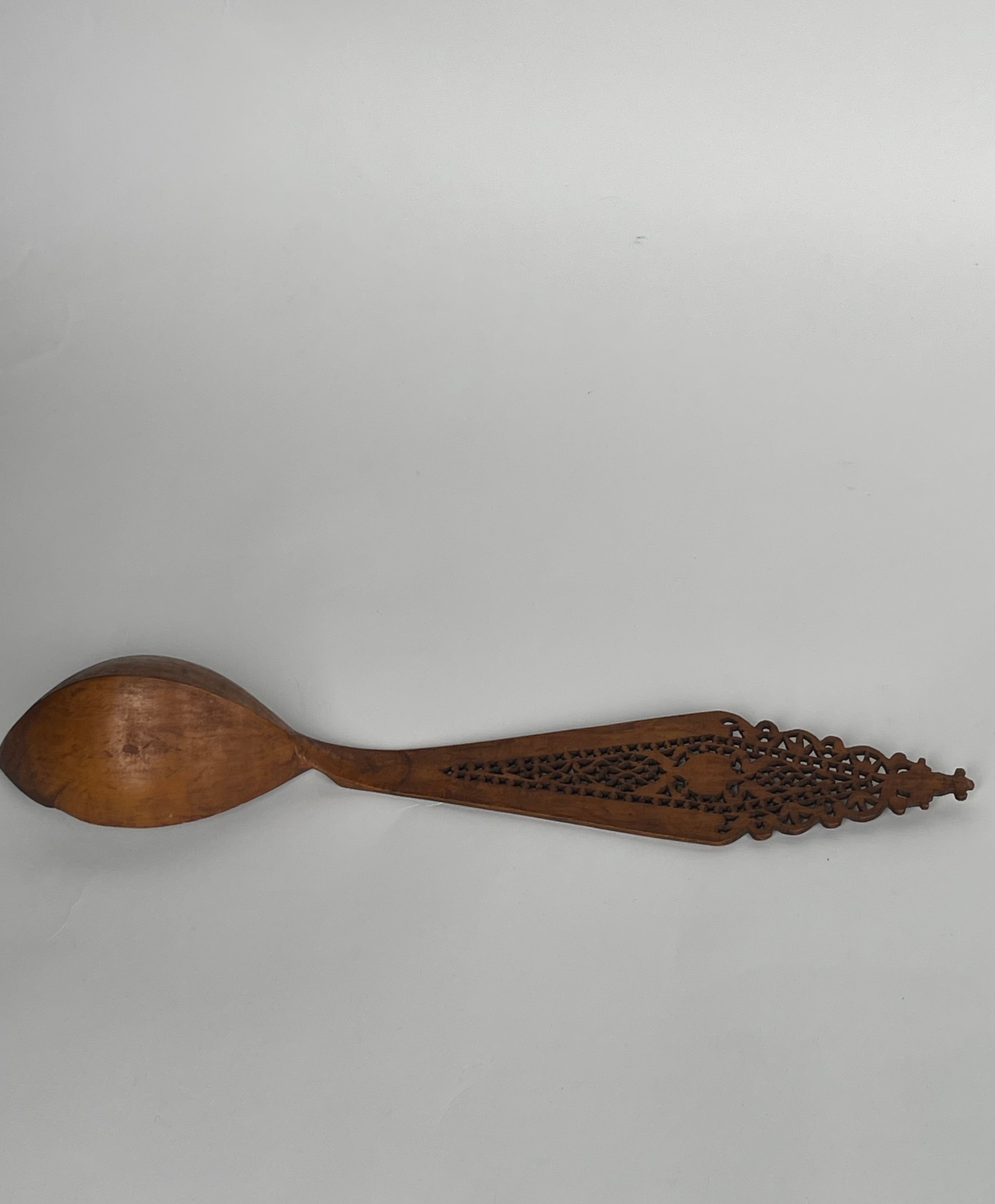 A Persian Qajar Hand Carved Wooden Sherbet Spoon.  Circa 1880