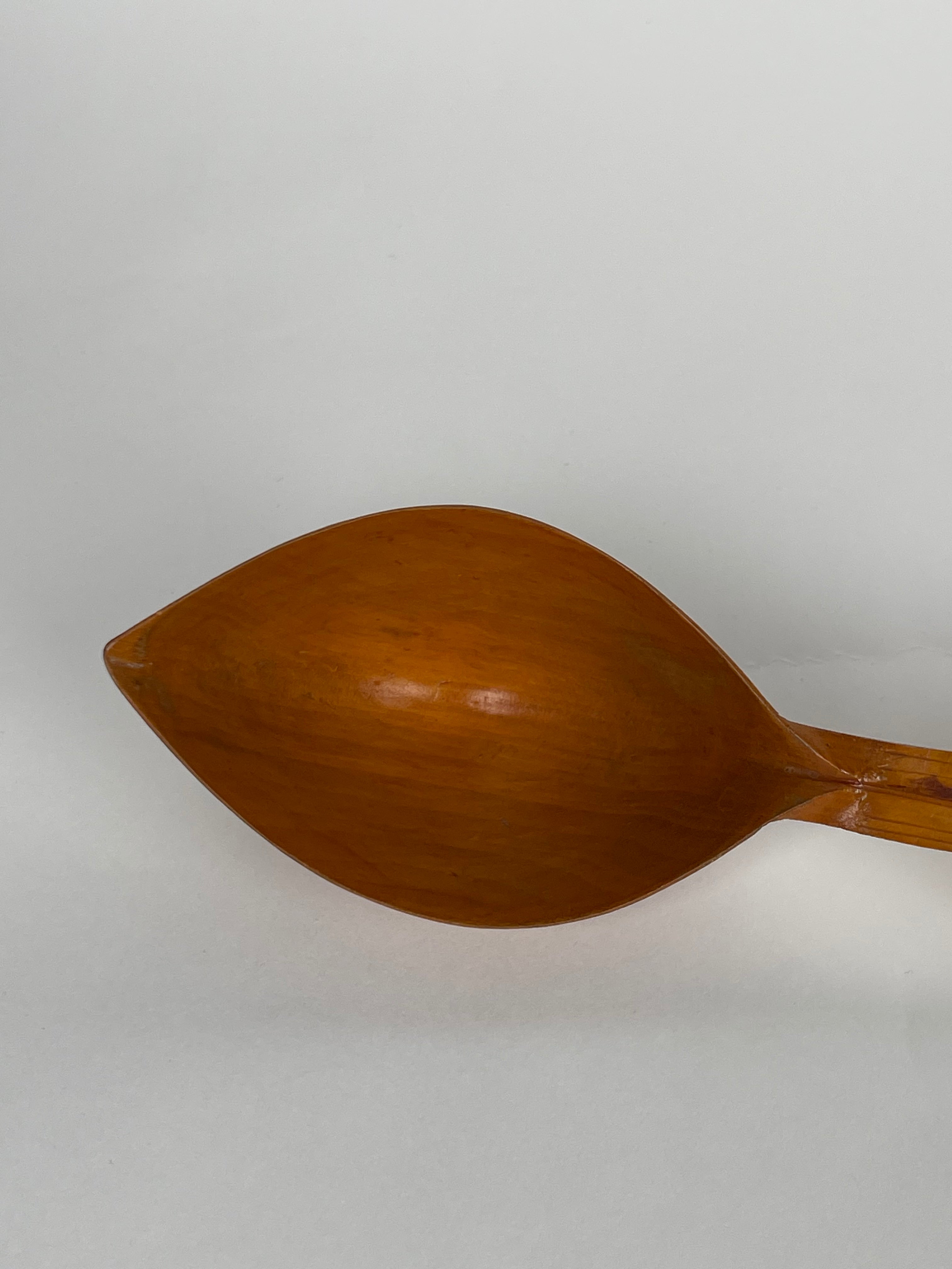 A Persian Qajar Hand Carved Wooden Sherbet Spoon. Circa 1880