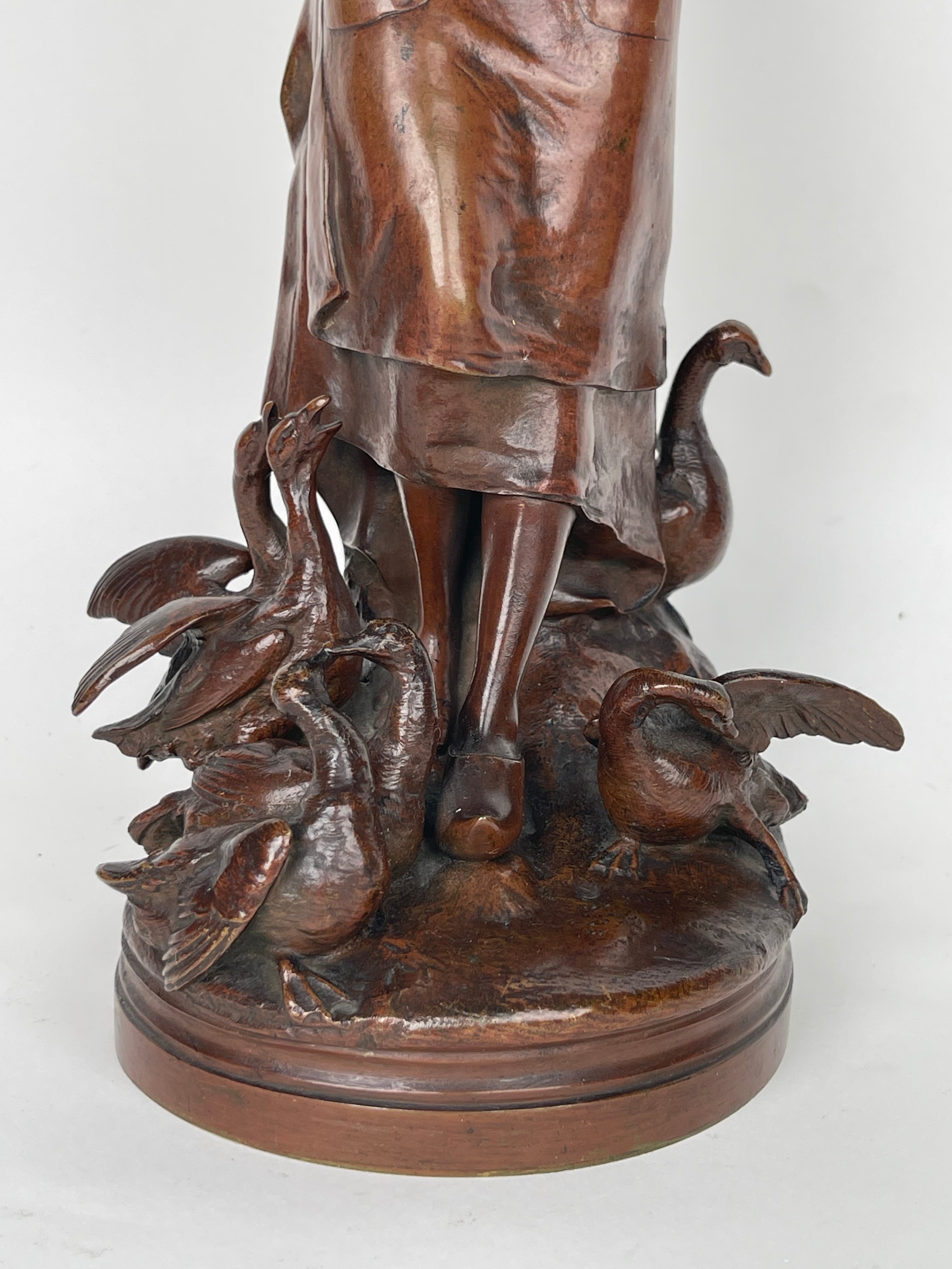 A Patinated Bronze Sculpture Of A Standing Lady Feeding Ducks By Lalouette