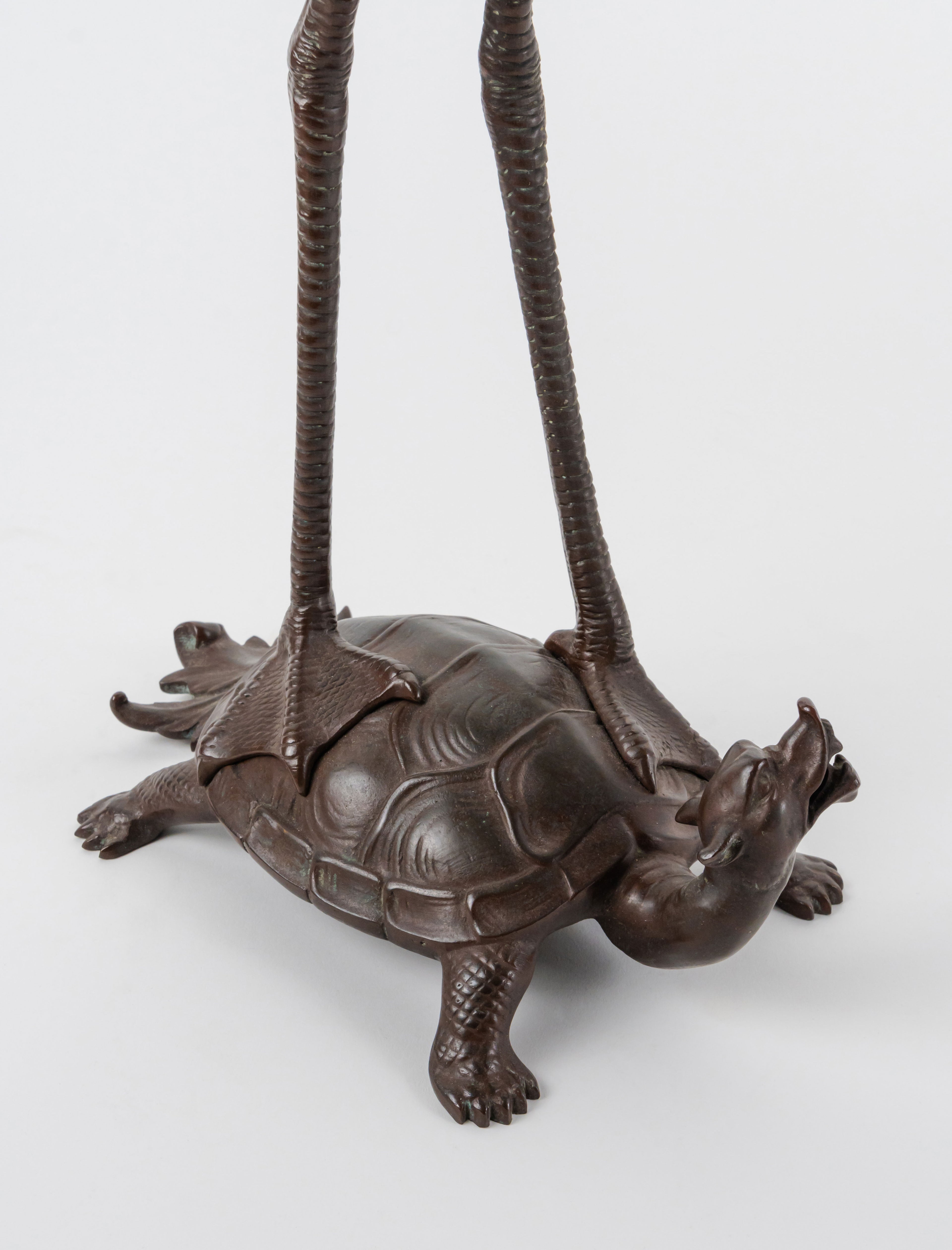 A Pair of French Japonaise Patinated Bronze Seven Light Candelabras