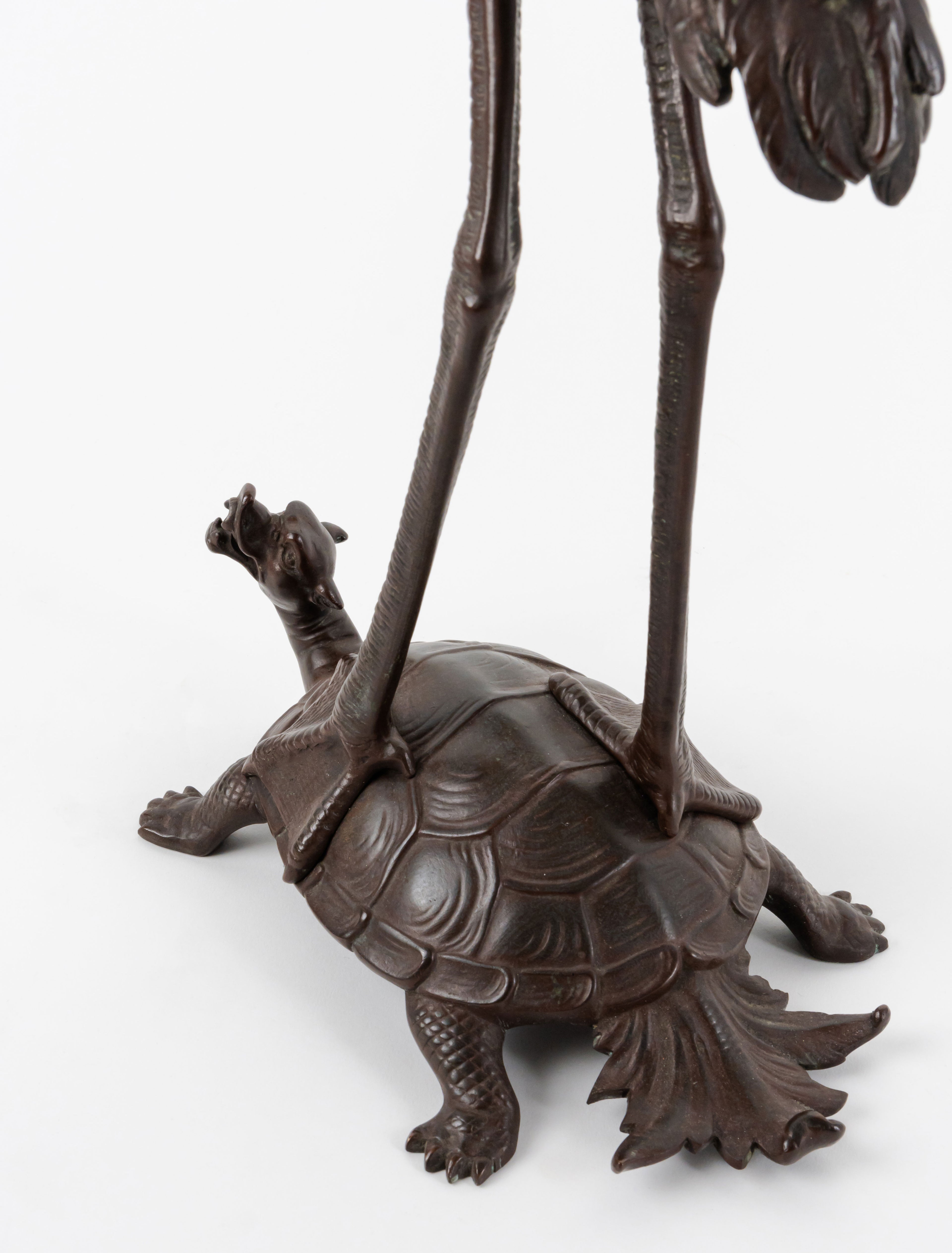 A Pair of French Japonaise Patinated Bronze Seven Light Candelabras