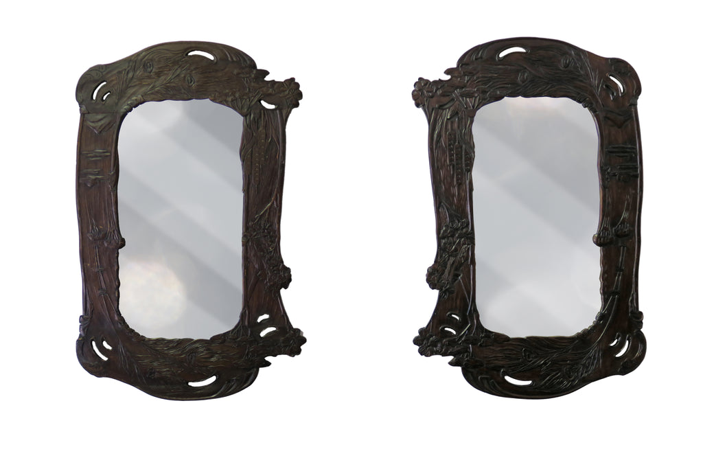 A Pair of Art Nouveau Hand Carved Walnut Mirrors