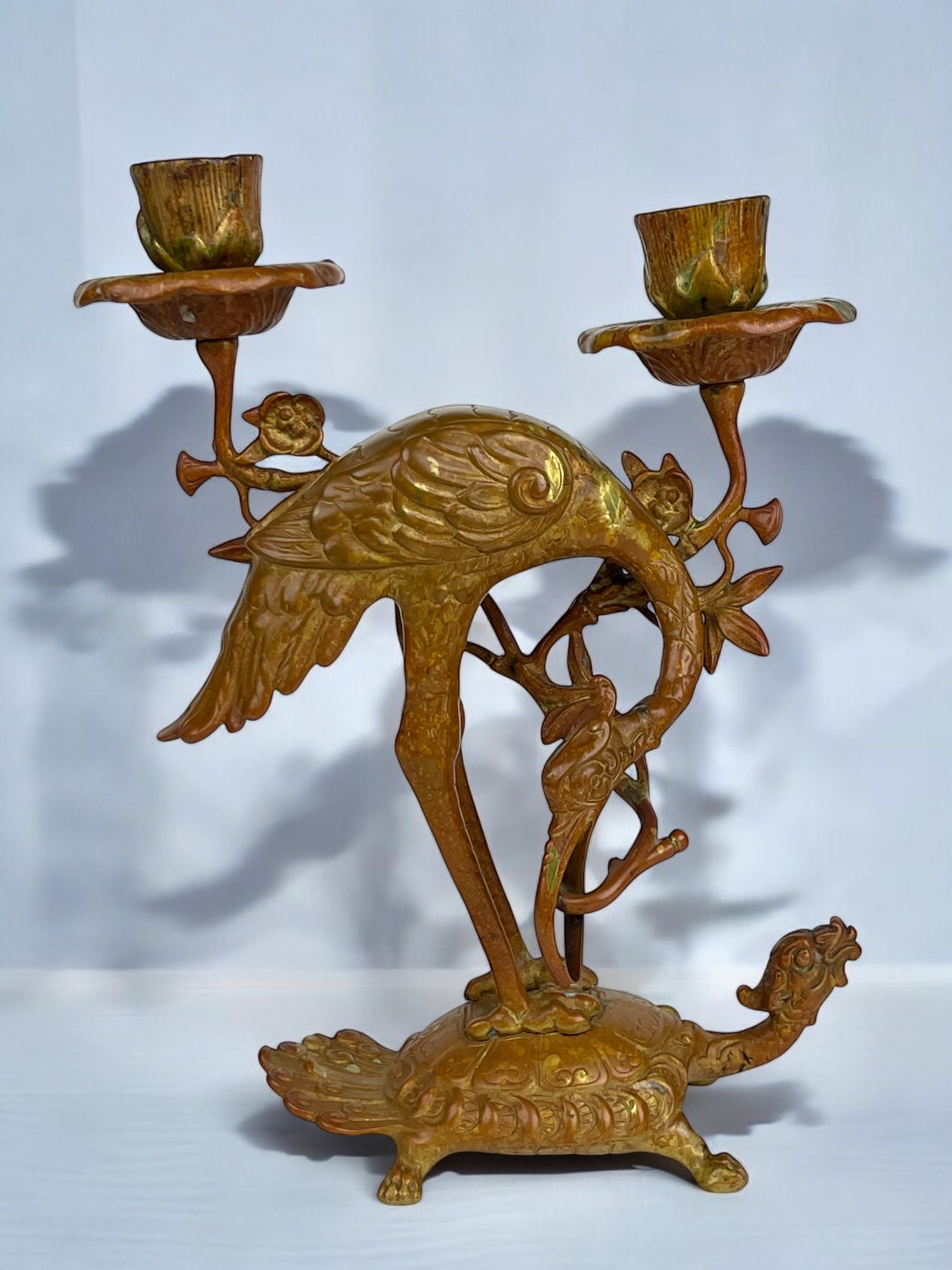 A Pair of French Chinoiserie Patinated Bronze Candle Sticks