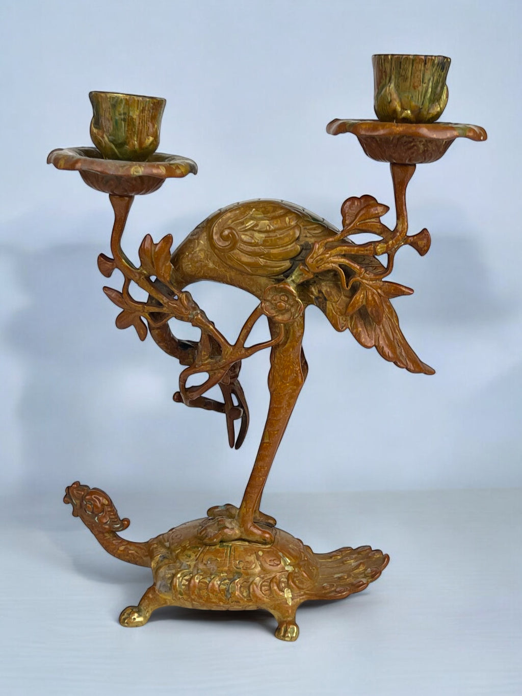 A Pair of French Chinoiserie Patinated Bronze Candle Sticks
